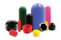 A collection of moulded plastic end caps in assorted styles, sizes, and colours.