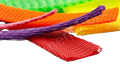 A selection of plastic protecting netting. In various sizes. Pink, Purple, Orange, Red, Yellow and Green.